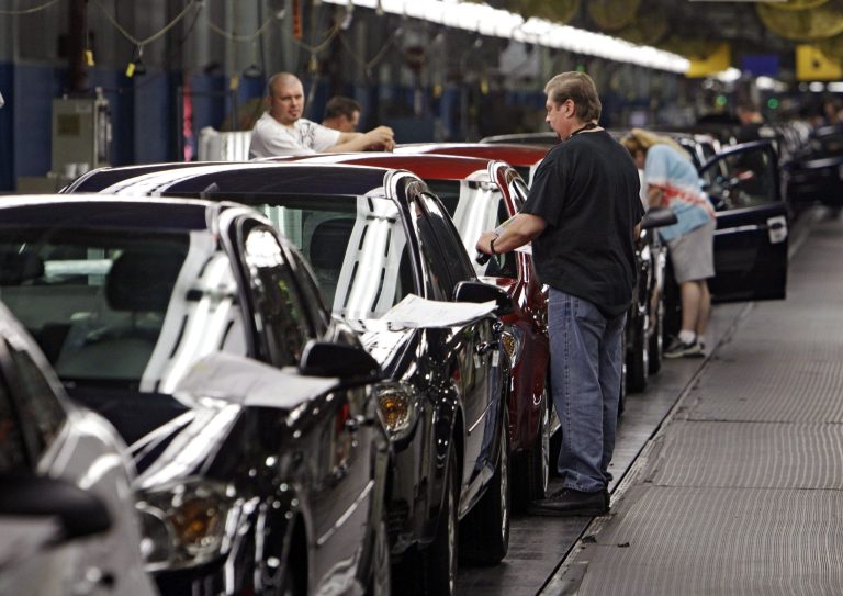 FILE - In this Tuesday, June 15, 2010, photo, workers at General Motors' Lordstown Assembly plant in Lordstown, Ohio put the final touches on Chevy Cobalts. U.S. safety regulators are demanding that General Motors turn over documents detailing what the company knew when about a dangerous ignition problem that has been linked to 13 car-crash deaths. (AP Photo/Mark Duncan, File)