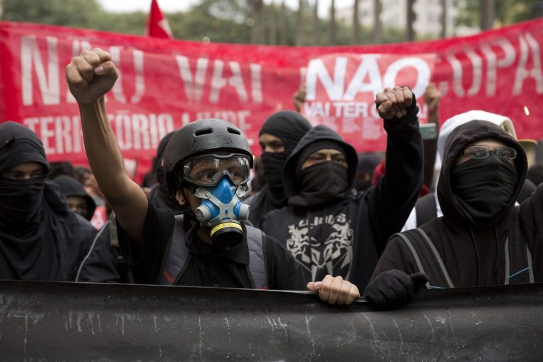 Demonstrators protest against money spent on the preparations for the upcoming World Cup, in Sao Paulo, Brazil, Saturday, May 24, 2014. The Sao Paulo police department said on its Twitter page that no violent incidents had been reported and that about 250 protesters took part in the demonstration which began outside the city's Roman Catholic cathedral. (AP Photo/Andre Penner)