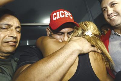 Lexander Loiza/AP
Wilson Ramos embraced family members on his return home Saturday after he was rescued from his kidnappers in Venezuela.