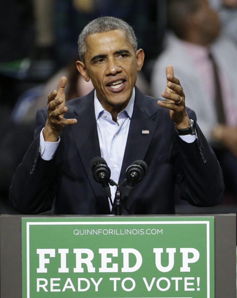 President Barack Obama addresses the crowd during an early voting and campaign rally for Illinois Gov. Pat Quinn at Chicago State University Sunday, Oct. 19, 2014, in Chicago. Early voting in Illinois starts Monday for the Nov. 4, election. (AP Photo/Charles Rex Arbogast)