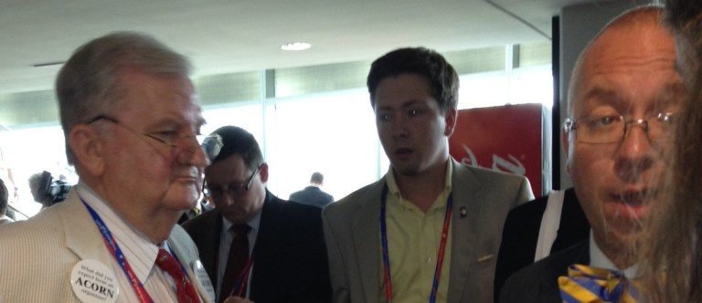 RNC Rules Committee member Morton Blackwell (Va.), left, works with fellow dissidents to gather enough signatures to force a floor fight over RNC rules on delegate selection.