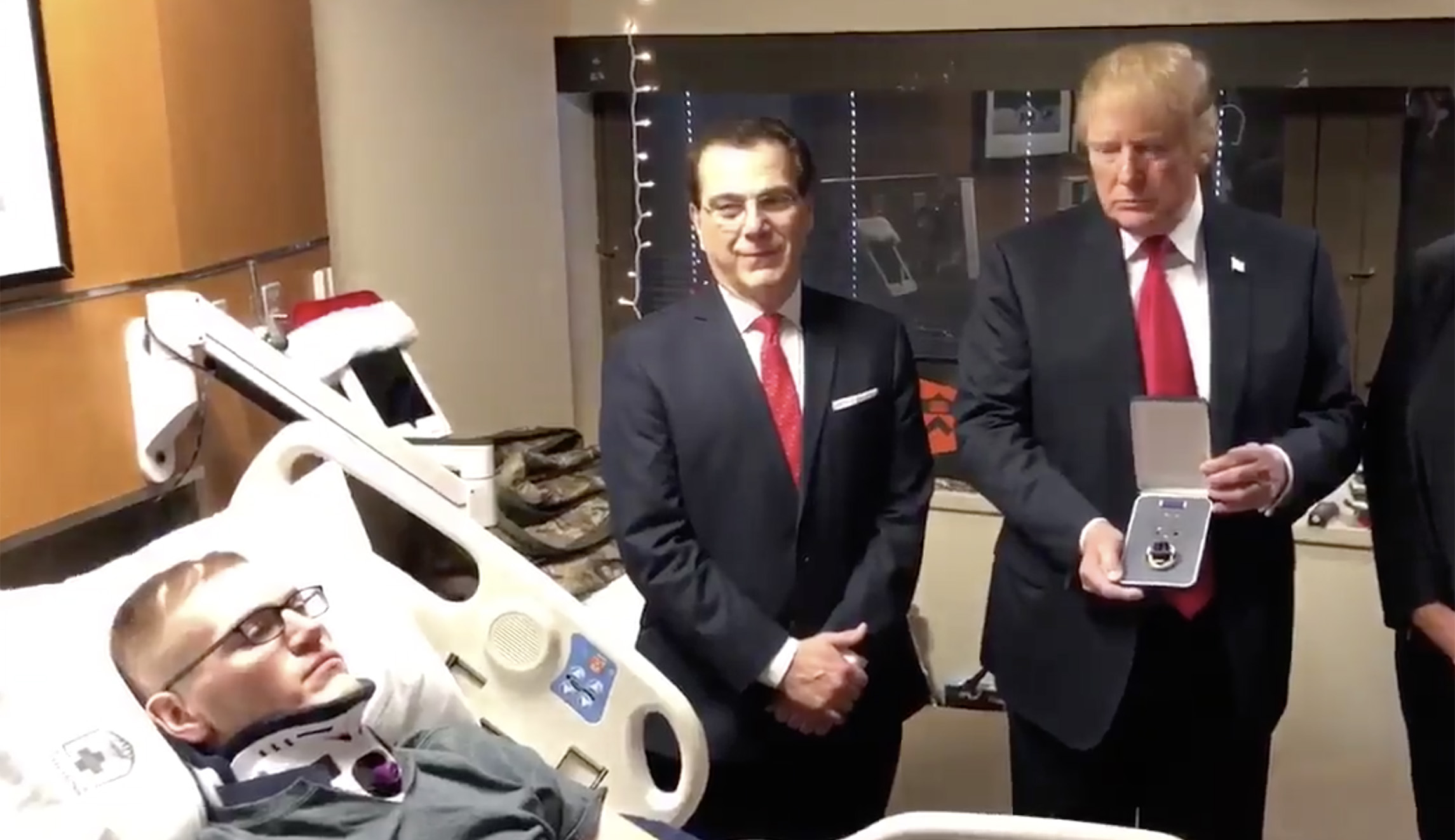 Trump awards wounded soldier Purple Heart during visit to Walter Reed