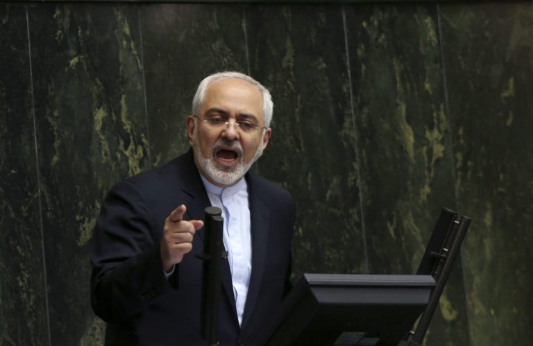 Iranian Foreign Minister Mohammad Javad Zarif, who is also Iran's top nuclear negotiator, addresses an open session of parliament in Tehran, Iran, Tuesday. (AP Photo/Vahid Salemi)