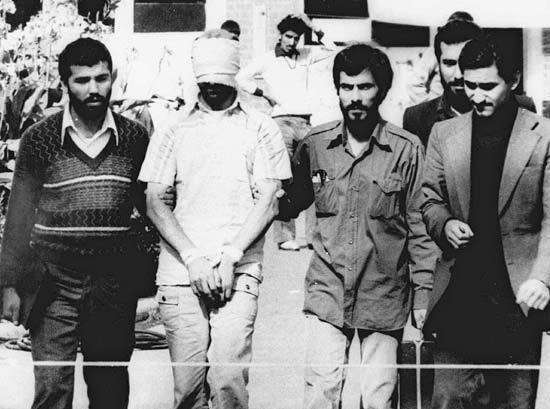 Blindfolded American hostage with his Iranian captors outside the U.S. embassy in Tehran, November 9, 1979.ÃÂ AP Photo