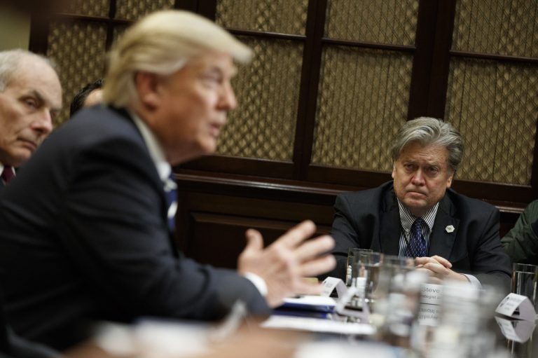 White House Chief Strategist Steve Bannon listens at right as President Donald Trump speaks during a meeting on cyber security in the Roosevelt Room of the White House in Washington, Tuesday, Jan. 31, 2017. (AP Photo/Evan Vucci)