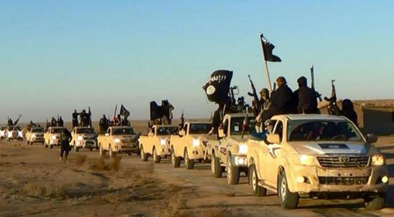 The U.S.-led coalition fighting the self-proclaimed Islamic State is zeroing in on the terrorist group's core territory and leadership, and is breaking down the group's morale, he Obama administration's anti-Islamic State czar said on Friday. (Militant website via AP, file)