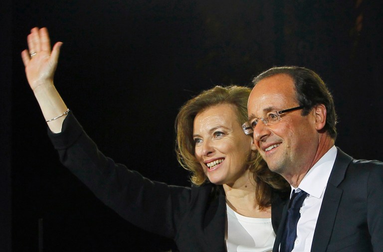FILE - This Sunday May 6, 2012 file photo shows French president-elect Francois Hollande and his companion Valerie Trierweiler celebrating his election victory in Bastille Square in Paris, France. A French news agency has reported that President Francois Hollande has ended his relationship with his companion of seven years Valerie Trierweiler. (AP Photo/Francois Mori, File)