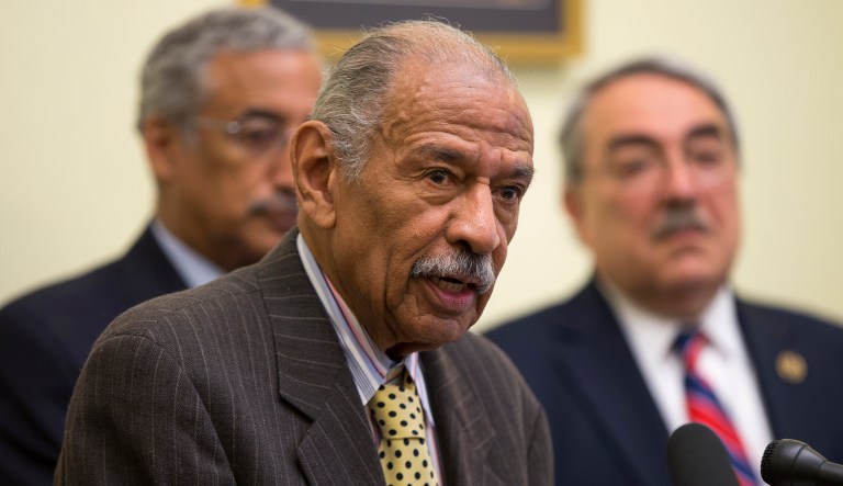 Detroit-area lawyer Arnold Reed says the 88-year-old Michigan Democrat will fight all accusations that he behaved inappropriately toward four former female members of his staff. (AP Photo/Evan Vucci)