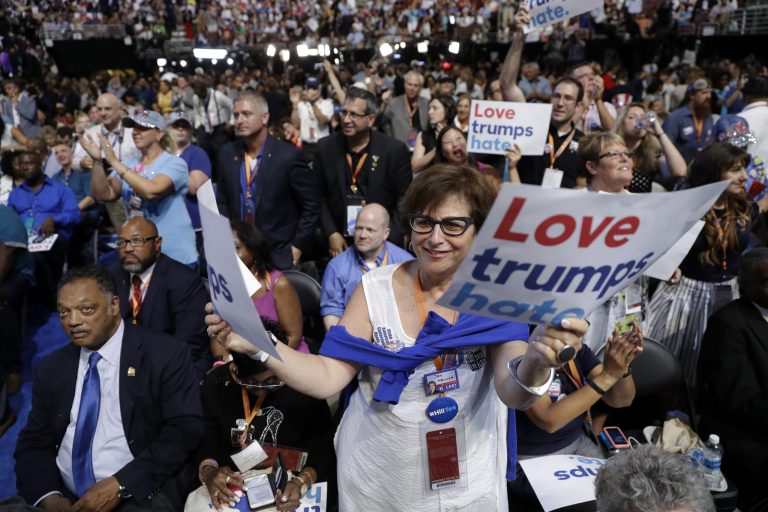 Illinois delegates cheer during the first day of the Democratic National Convention in Philadelphia , Monday, July 25, 2016. At left is The Rev. Jesse Jackson. (AP Photo/Matt Rourke)