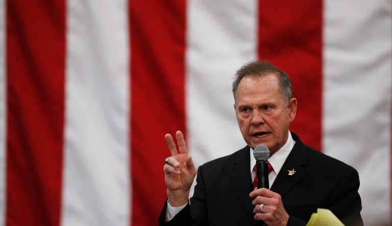 The Moore camp just couldn't comprehend how a victim could stay silent for so many years. (AP Photo/Brynn Anderson)