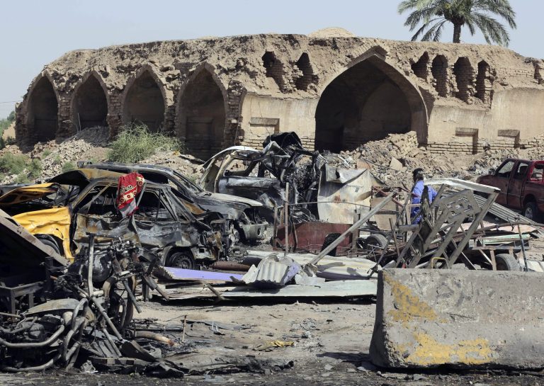The debris from a deadly Friday night suicide car bombing at a busy market in Khan Beni Saad, about 20 miles northeast of Baghdad, Iraq, Saturday. (AP Photo/Karim Kadim)