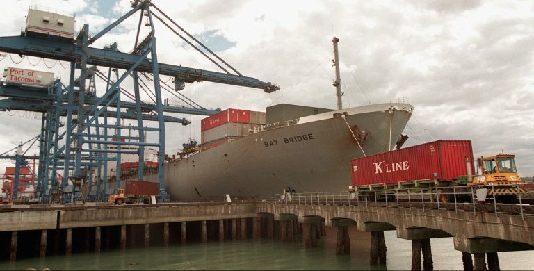 FILE - In this Friday, Sept. 5, 1997 file photo, containers are unloaded from the 