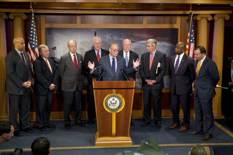 Sen. Chuck Schumer, center, speaks about criminal justice reform, accompanied by a bipartisan group of senators, during a news conference on Capitol Hill in Washington. (AP Photo/Jacquelyn Martin)