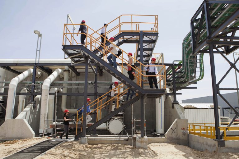 In this Sunday, May 4, 2014 photo, workers climb stairs at the Sorek desalination plant in Rishon Letzion, Israel. Israel's aggressive desalination program that has transformed this perennially parched country into perhaps the most well-hydrated country in the region. (AP Photo/Dan Balilty)