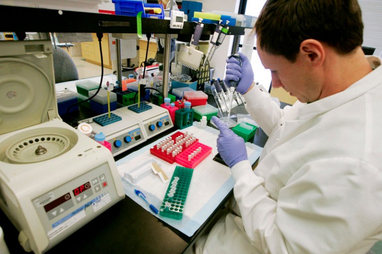Lab technician Jarrod Morgan tests DNA samples at Pathway Genomics Corp. in San Diego, Calif. (Sandy Huffaker/Bloomberg)