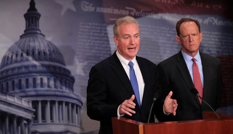 Sen. Chris Van Hollen, D-Md., and Sen. Patrick Toomey, R-Pa., speak about sanctions related to North Korea. The Senate Banking Committee passed the BRINK Act unanimously in a vote timed to take place hours before President Trump arrives in China for diplomatic meetings. (AP Photo/Manuel Balce Ceneta)