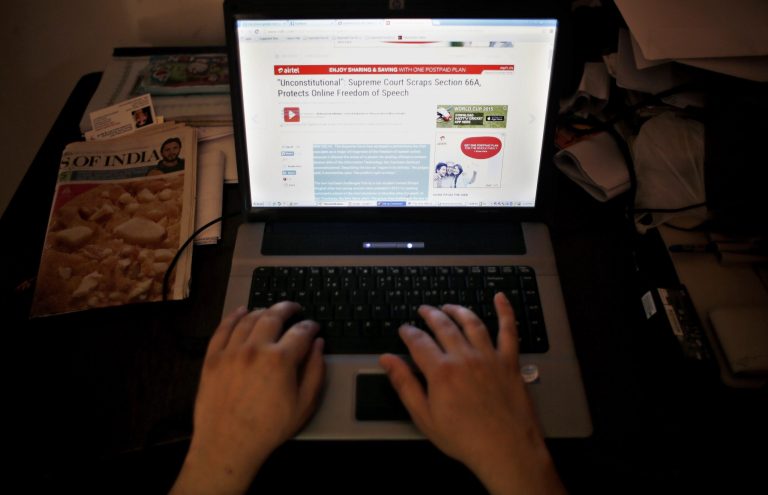 An Indian man surfs the internet inside an internet cafe in New Delhi, India, Tuesday, March 24, 2015. (AP Photo/Altaf Qadri)