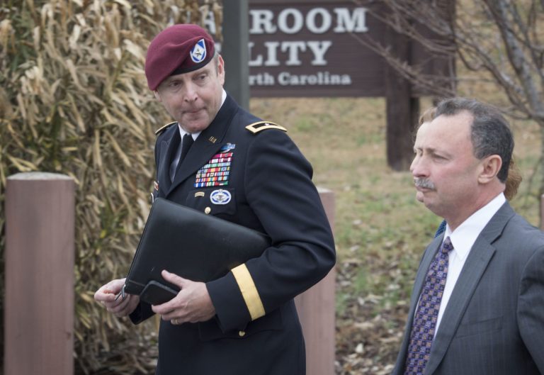 Brig. Gen. Jeffrey Sinclair, left,  leaves the Fort Bragg courthouse, Monday, March 17, 2014 with his defense attorney Richard Scheff. (AP Photo/The Fayetteville Observer, Johnny Horne)