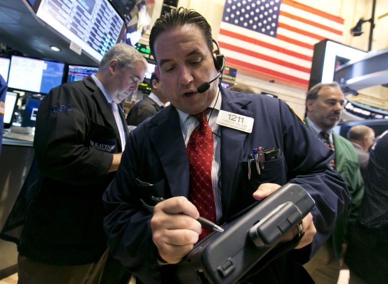 Trader Tommy Kalikas, center, works on the floor of the New York Stock Exchange Thursday, Aug. 21, 2014. U.S. stocks are opening higher, pushing the Standard & Poor's 500 index closer toward another record high. (AP Photo/Richard Drew)