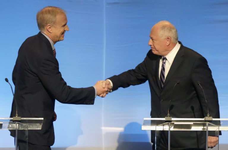 FILE - In this Oct. 14, 2014 file photo, Illinois gubernatorial candidates Republican Bruce Rauner, left, and Democrat Gov. Pat Quinn greet each before a debate in Chicago. Quinn and Rauner are gearing up for their third and likely final televised debate Monday, Oct. 20, 2014 locked in a neck-and-neck contest ahead of the November election. (AP Photo/Charles Rex Arbogast, File)
