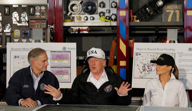 President Trump, flanked by Texas Gov. Greg Abbott and first lady Melania Trump speaks during a briefing on Harvey relief efforts in Corpus Christi, Texas. (AP Photo/Evan Vucci)