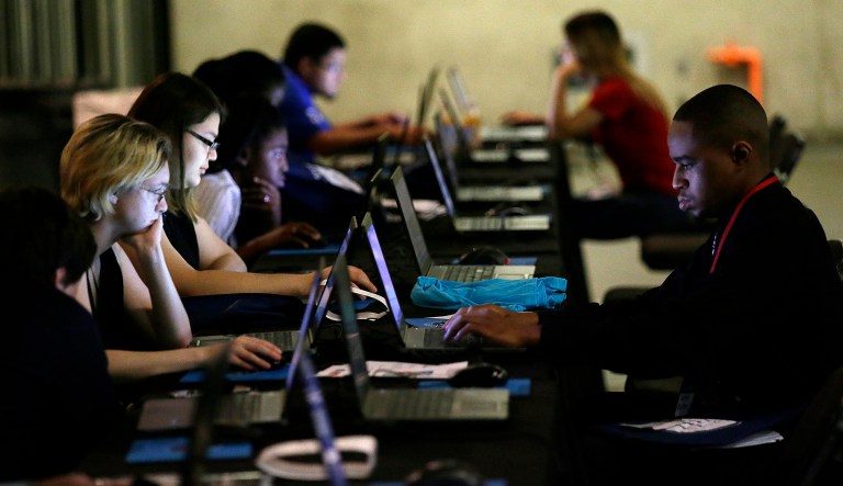 The jobs report vindicated economists' belief that September's weak report, which originally showed 33,000 lost jobs, reflected the one-time impact of Hurricanes Harvey and Irma rather than a broader economic slowdown. (AP Photo/LM Otero, File)