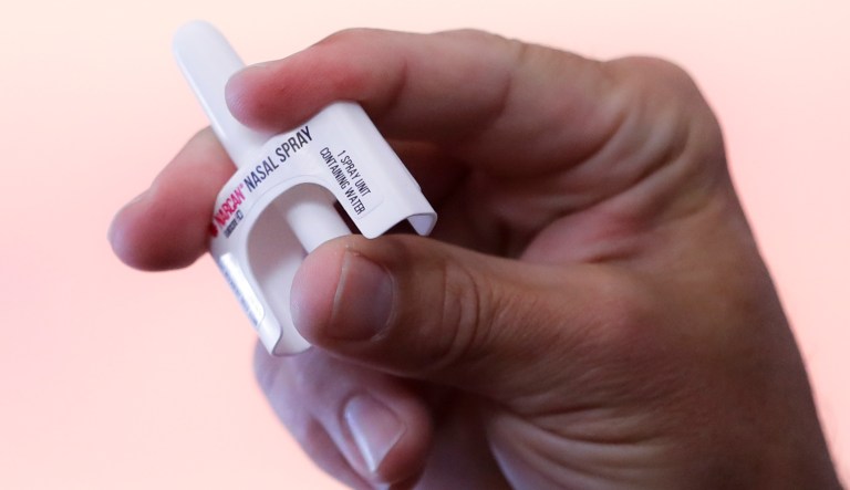 The company will provide the nasal spray Narcan without a co-pay. (AP Photo/John Minchillo)