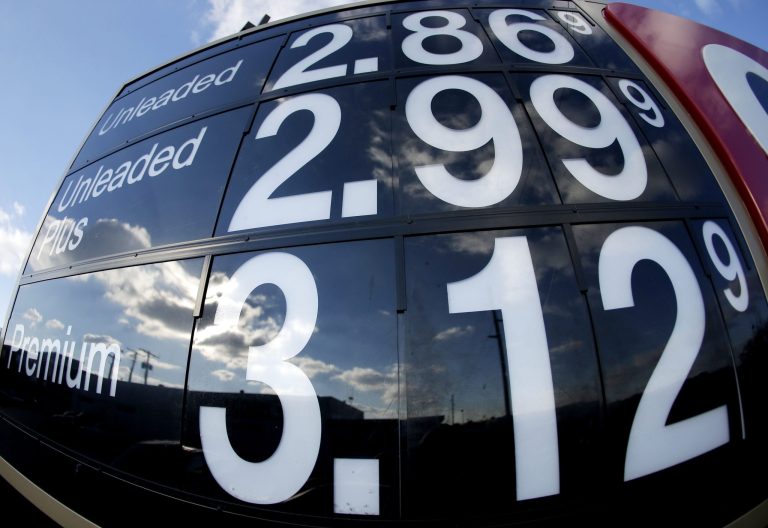 A gas station advertises regular unleaded gasoline for less than $3.00 a gallon in Independence, Mo. 