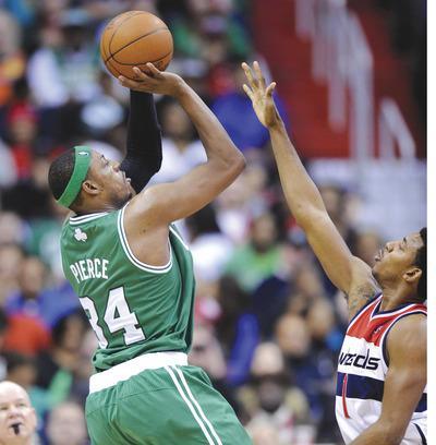 Nick Wass/AP
Paul Pierce had 34 points, 10 assists and eight rebounds in the Celtics'win over the Wizards on Sunday at Verizon Center.