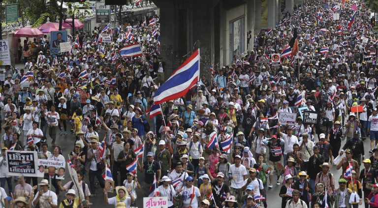 Thai anti-government protesters fill the street during a mass rally in Bangkok, Thailand Saturday, March 29, 2014. Tens of thousands of anti-government protesters marched through the streets of the Thai capital Saturday, reviving their whistle-blowing, traffic-blocking campaign to force the resignation of the prime minister Yingluck Shinawatra and seeking the country to reform before the election. (AP Photo/Apichart Weerawong)