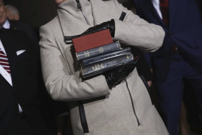 The Bibles for the presidential inauguration are carried onto the West Front of the U.S. Capitol on Friday, Jan. 20, 2017, in Washington, for Donald Trump's inauguration ceremony as the 45th president of the United States. (Win McNamee/Pool Photo via AP)