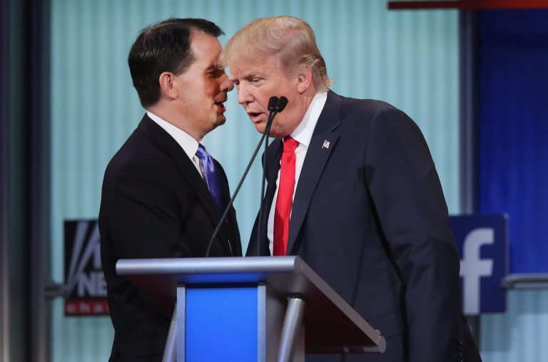 Republican presidential candidate Wisconsin Gov. Scott Walker (L) chats with Donald Trump during a break in the first Republican presidential debate hosted by Fox News. (Photo by Scott Olson/Getty Images)