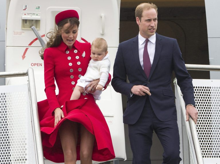 Britain's Prince William and his wife Kate, the Duchess of Cambridge with Prince George arrive for their visit to New Zealand at the International Airport, in Wellington, New Zealand, Monday, April 7, 2014. (AP Photo/SNPA, David Rowland) NEW ZEALAND OUT