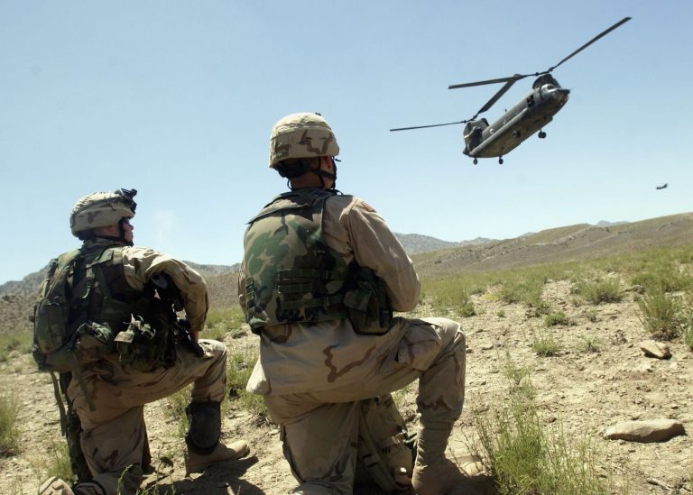 BAGRAM, AFGHANISTAN - JUNE 3:  U.S. soldiers of the 82nd Airborne prepare to board a Chinook helicopter at the end of Operation Dragon Fury June 3, 2003 in Bagram, Afghanistan. The operation took place in the Showi Kowt Mountains in Eastern Afghanistan, in the same vicinity as Operation Anaconda, and was the largest since that mission was undertaken in March 2002. (Photo by Darren McCollester/Getty Images)