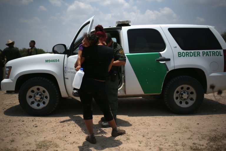 A mother and child, 3, from El Salvador await transport by the U.S. Border Patrol to a processing center for undocumented immigrants after they crossed the Rio Grande into the United States on July 24, 2014 in Mission, Texas. House Judiciary Committee Chairman Bob Goodlatte, R-Va., has promoted a piecemeal approach to reforming immigration laws that would begin with strengthening border security. (Photo by John Moore/Getty images)
