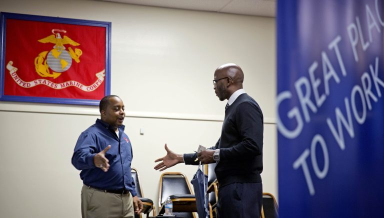 In this  Thursday, Nov. 14, 2013, file photo, retired U.S. Army Sgt. 1st Class Duane Stubbs, right, of Morrow, Ga., shakes hands with retired U.S. Army 1st Sgt. Leland Smith, CEO of SolidHires, during a job fair for veterans at the VFW Post 2681, in Marietta, Ga. Unemployment rates fell or were unchanged in all 50 U.S. states in November, evidence that hiring is improving across the country. (AP Photo/David Goldman, File)