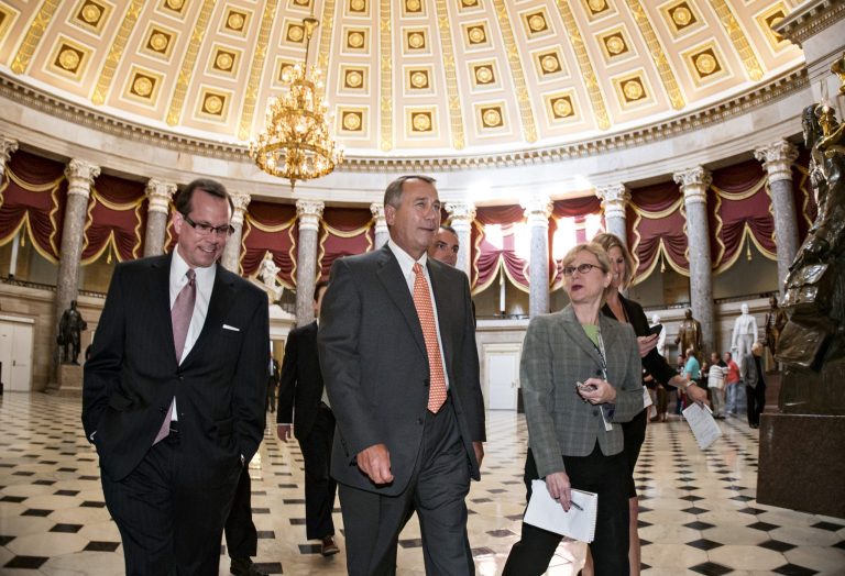 Speaker of the House John Boehner, R-Ohio, is flanked by reporters as he walks through Statuary Hall at the Capitol on the way to the House Chamber during a procedural vote related to the continuing resolution for fiscal year 2014 funding, in Washington, Thursday, Sept. 19, 2013. The White House is promising to veto, if necessary, a Republican effort to wreck President Barack Obama's health care law as part of House legislation to prevent a partial government shutdown. (AP Photo/J. Scott Applewhite)