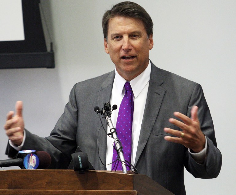 North Carolina Gov. Pat McCrory received a school safety report Friday with nearly 80 recommendations from Department of Public Safety Secretary Frank Perry at a Wilmington news conference. (AP Photo/Rhett Butler)