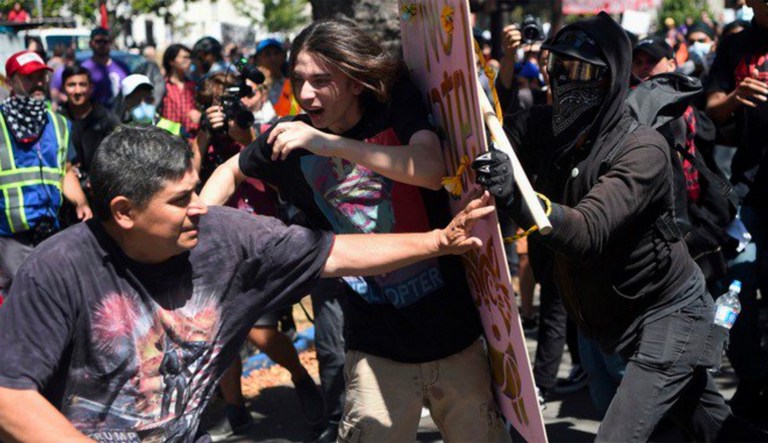 People who write and talk about the street brawlers of the fringe Left should refuse to dignify them with their preferred label. (@itvnews/Twitter)