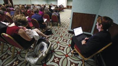 Bob Brown/Richmond Times-Dispatch via AP
Victoria Cobb, left, president of the pro-life Family Foundation, brought her 3-week-old daughter to a meeting of the Virginia State Board of Health in Henrico County, Va., on Thursday, where the agenda was abortion clinic regulations.