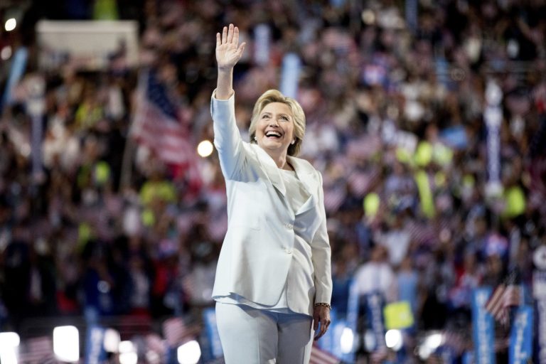 By the end of Hillary Clinton's first term in office, U.S. economic output would be 1.7 percent higher than it would be under current law if her plans were implemented as they're spelled out on paper. (AP Photo)