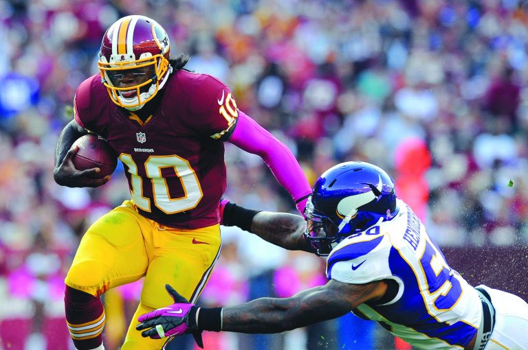 Pablo Martinez Monsivais/AP
The Redskins' Robert Griffin III ran for 138 yards Sunday, including a 76-yard touchdown in the fourth quarter.