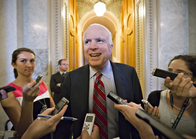 Sen. John McCain, R-Ariz., takes reporters' questions on Syria as he leaves the chamber following votes on amendments to the Immigration Reform Bill in the Senate, at the Capitol in Washington, Tuesday, June 18, 2013.  (AP Photo/J. Scott Applewhite)