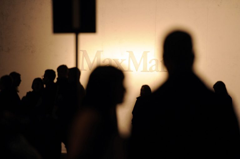 Guests wait for the start of the Max Mara women's Fall-Winter 2014-15 collection, part of the Milan Fashion Week, unveiled in Milan, Italy, Thursday, Feb. 20, 2014. (AP Photo/Giuseppe Aresu)