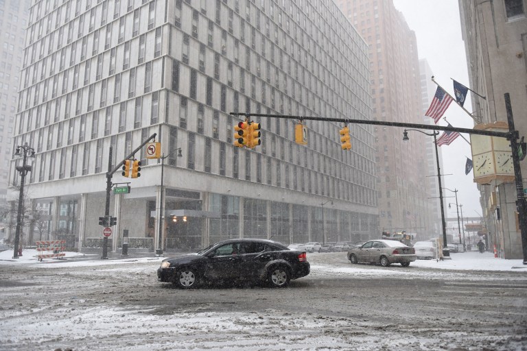 Federal workers were granted a three-hour delay in getting to work on Tuesday, after Winter Storm Stella dumped about three inches of slow and sleet on the nation's capital. (Tanya Moutzalias/The Ann Arbor News-MLive.com Detroit via AP)