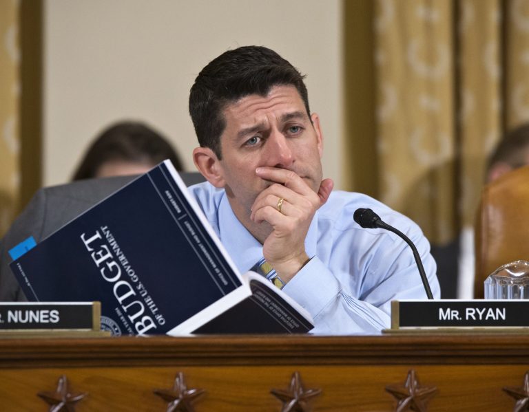 House Budget Committee Chairman Rep. Paul Ryan, R-Wis., a member of the House Ways and Means Committee, holds a copy of President Barack Obama's fiscal 2014 budget proposal book as he questions Health and Human Services (HHS) Secretary Kathleen Sebelius on Capitol Hill in Washington, Friday, April 12, 2013, as Sebelius testified before the House Ways and Means Committee hearing on the HHS fiscal 2014 budget request. (AP Photo/J. Scott Applewhite)