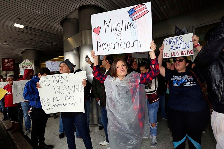 Protesters rally against President Trump's refugee ban at Miami International Airport on Sunday, Jan. 29, 2017. (C.M. Guerrero/El Nuevo Herald via AP)