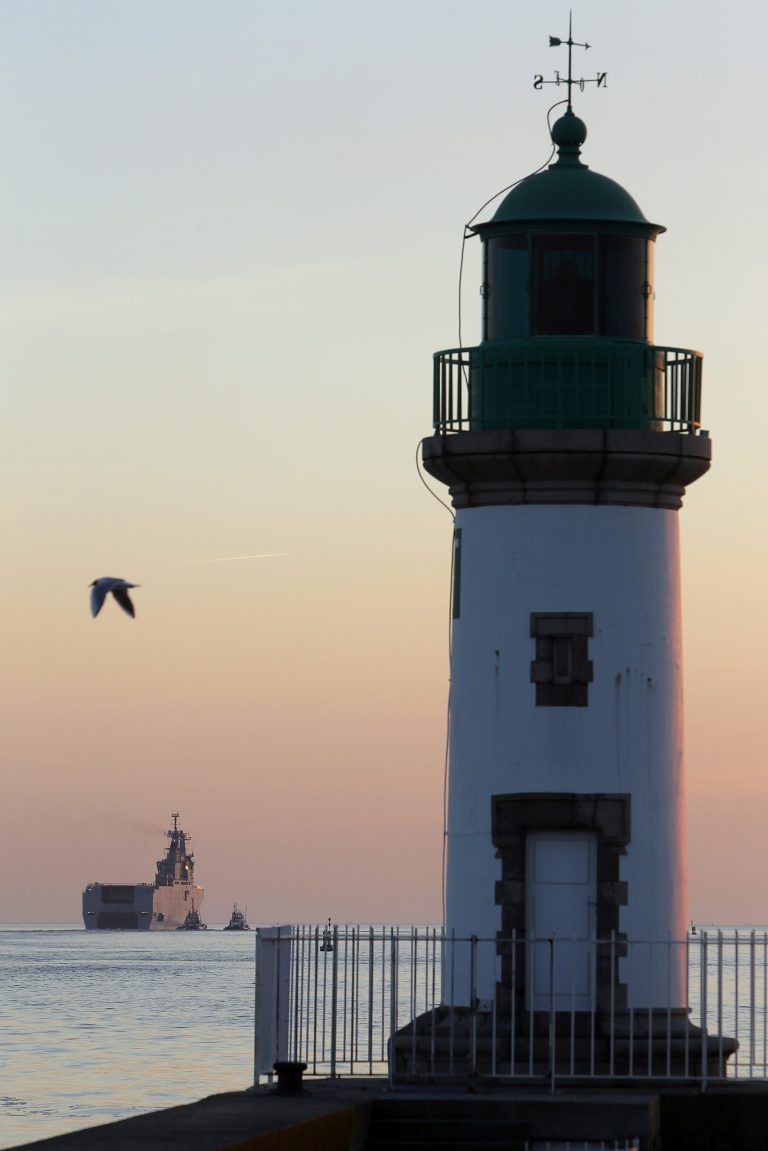 French-built warship BPC Vladivostock, designed to strengthen Russia's ability to deploy troops, tanks and helicopter gunships, leaves the Saint Nazaire's harbor, western France, for its test run on the open sea off coast of France, Wednesday, March 5, 2014, just as Western powers are trying to rein in Russian President Vladimir Putin's military threat to Ukraine. The warship is part of a 1.2-billion-euro deal ($1.6-billion) that marked the biggest-ever sale of NATO weaponry to Moscow, a deal that already raised eyebrows both within Russia's military circles and among France's Western allies when it was struck in 2011. (AP Photo/David Vincent)