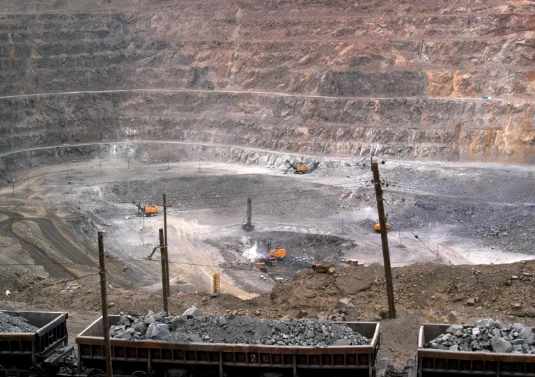 In this photo taken on Tuesday, July 6, 2010, workers use machinery to dig at a rare earth mine in Baiyunebo mining district of Baotou in north China's Inner Mongolia Autonomous Region. China's government has tightened controls on rare earths production in a move that might inflame trade tensions with Washington and Europe. Regulations issued this week say mines and smelting companies must meet minimum output levels to continue operating. (AP Photo) CHINA OUT