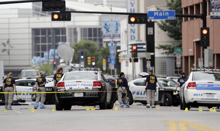 Investigators Saturday work in the area of downtown Dallas where Thursday's shootings occurred (AP Photo/Eric Gay)